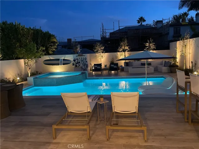 a view of a chairs and table in the patio