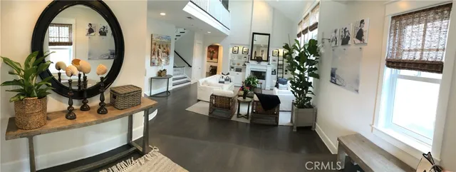 a view of living room filled with furniture and floor to ceiling window