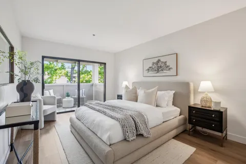 a bedroom with a bed and a couch
