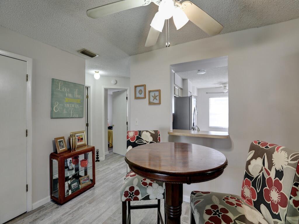 6022 Indrio Road, Unit 3 Fort Pierce, FL 34951 - Photo 14 of 35 a view of a livingroom with furniture and a couch