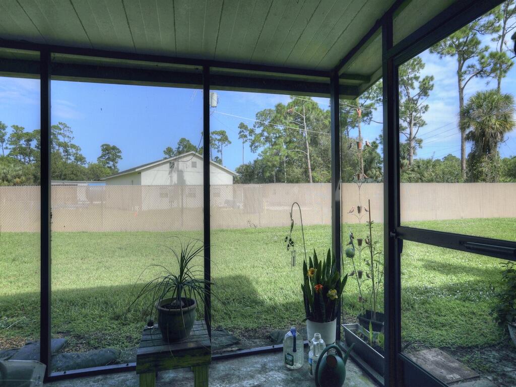6022 Indrio Road, Unit 3 Fort Pierce, FL 34951 - Photo 31 of 35 a view of a back yard from a balcony