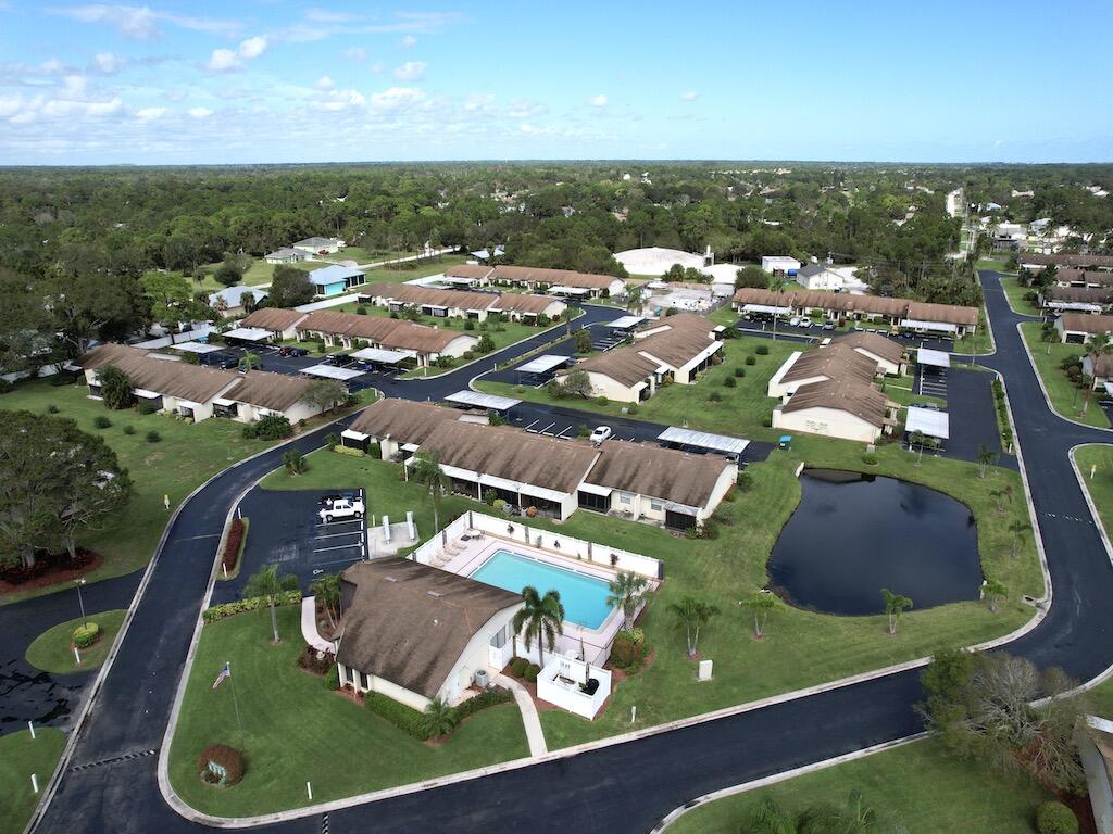 6022 Indrio Road, Unit 3 Fort Pierce, FL 34951 - Photo 33 of 35 an aerial view of residential houses with outdoor space