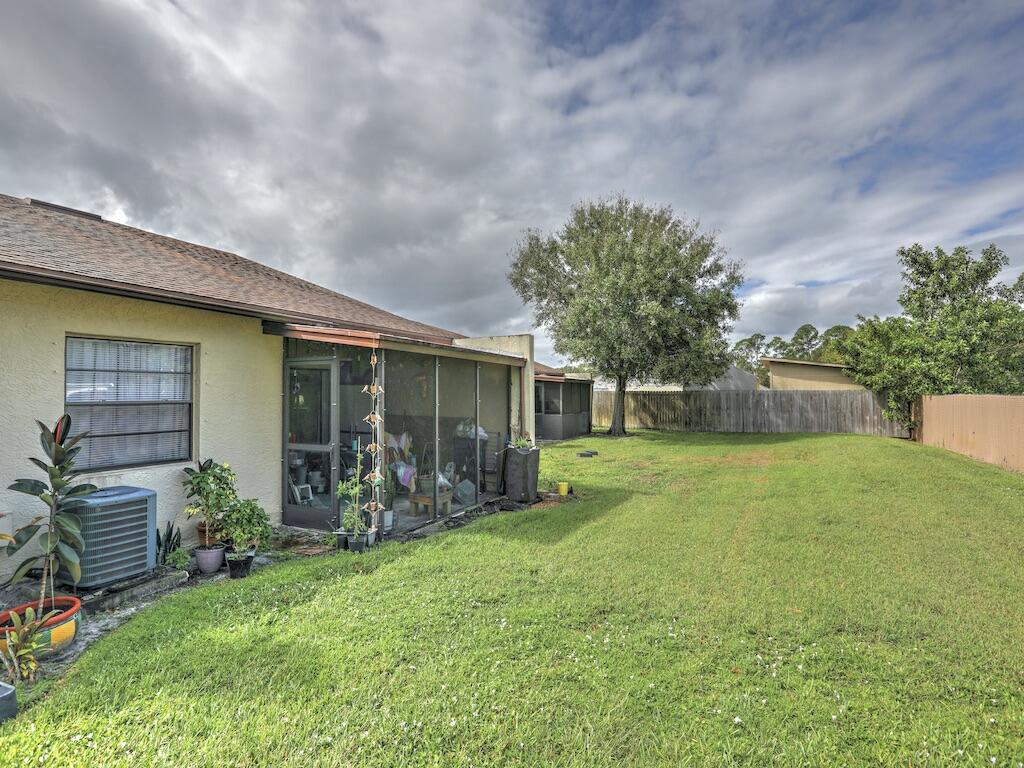6022 Indrio Road, Unit 3 Fort Pierce, FL 34951 - Photo 4 of 35 a front view of house with yard and green space