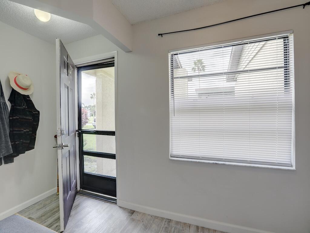 6022 Indrio Road, Unit 3 Fort Pierce, FL 34951 - Photo 6 of 35 a view of walk in closet with empty racks