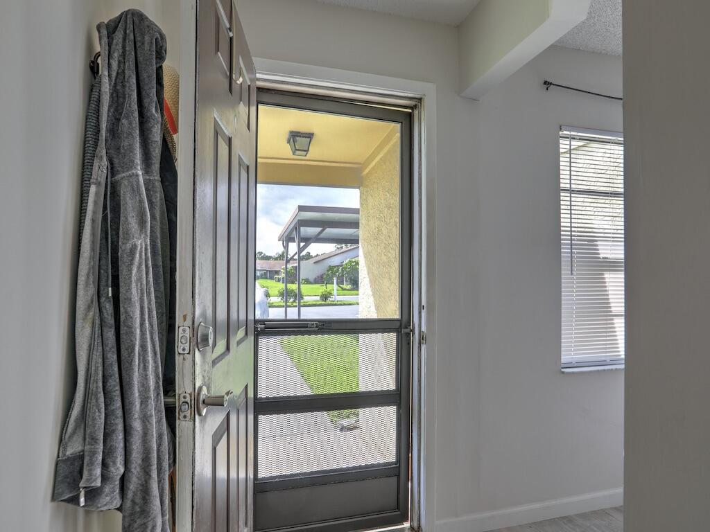 6022 Indrio Road, Unit 3 Fort Pierce, FL 34951 - Photo 8 of 35 a view of a front door