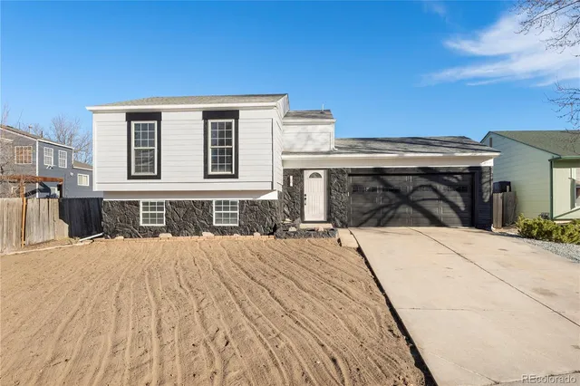 a front view of a house with yard