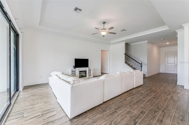 a room with furniture and a flat screen tv