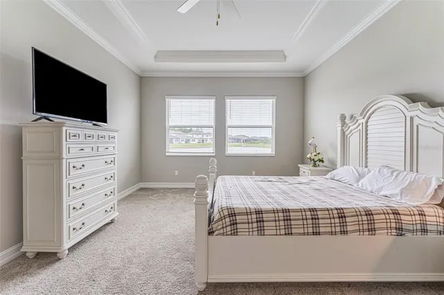a bedroom with a bed and flat screen tv