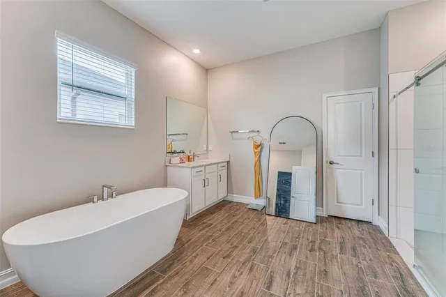 a bathroom with a bathtub and a sink