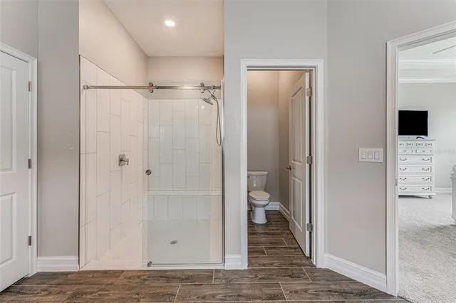 a view of a bathroom with a glass door shower