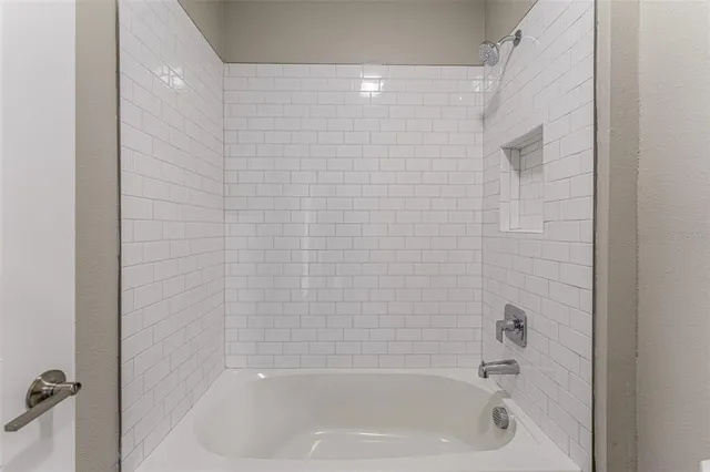 a close up of a bathtub curtain