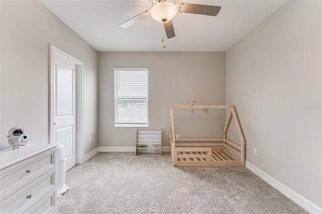 a view of room with a window and cabinet