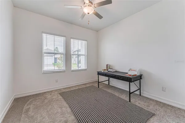 a bench sitting in a room next to a window