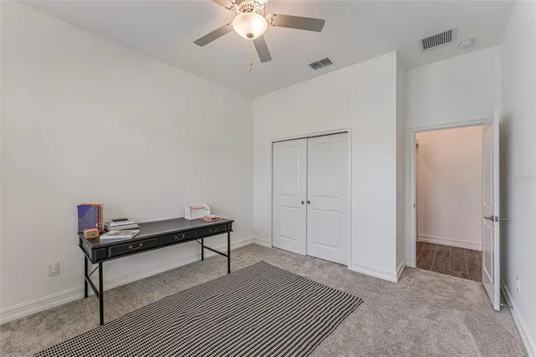 a room with a bed and a chandelier