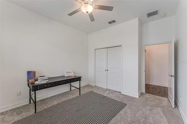 a room with a bed and a chandelier