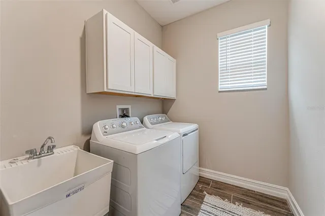 a view of storage and utility room with washer and dryer