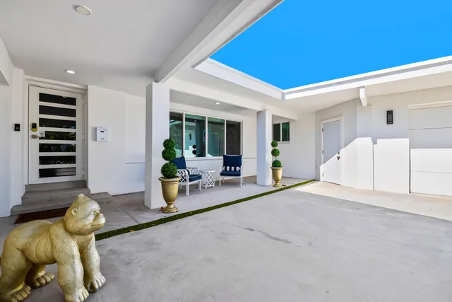a view of a livingroom with furniture and windows