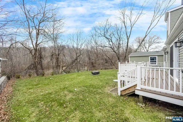 a view of a deck with a yard