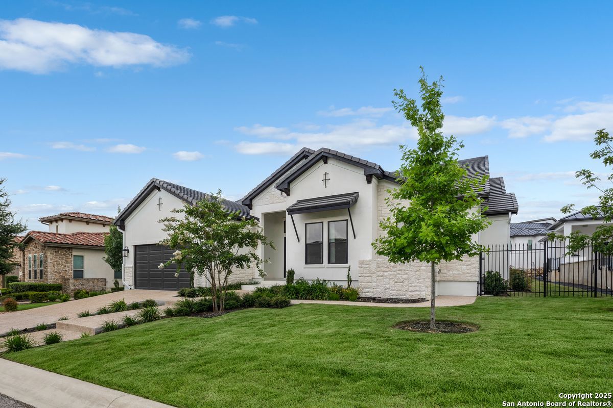 7203 Bluff Run San Antonio, TX 78257 - Photo 1 of 1 a front view of a house with a garden