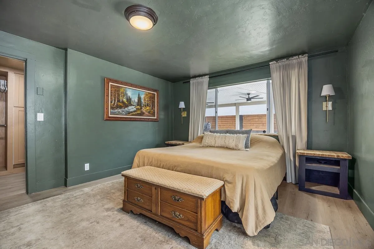 1211 East Mission Road Fallbrook, CA 92028 - Photo 16 of 31 a spacious bedroom with a bed and a window