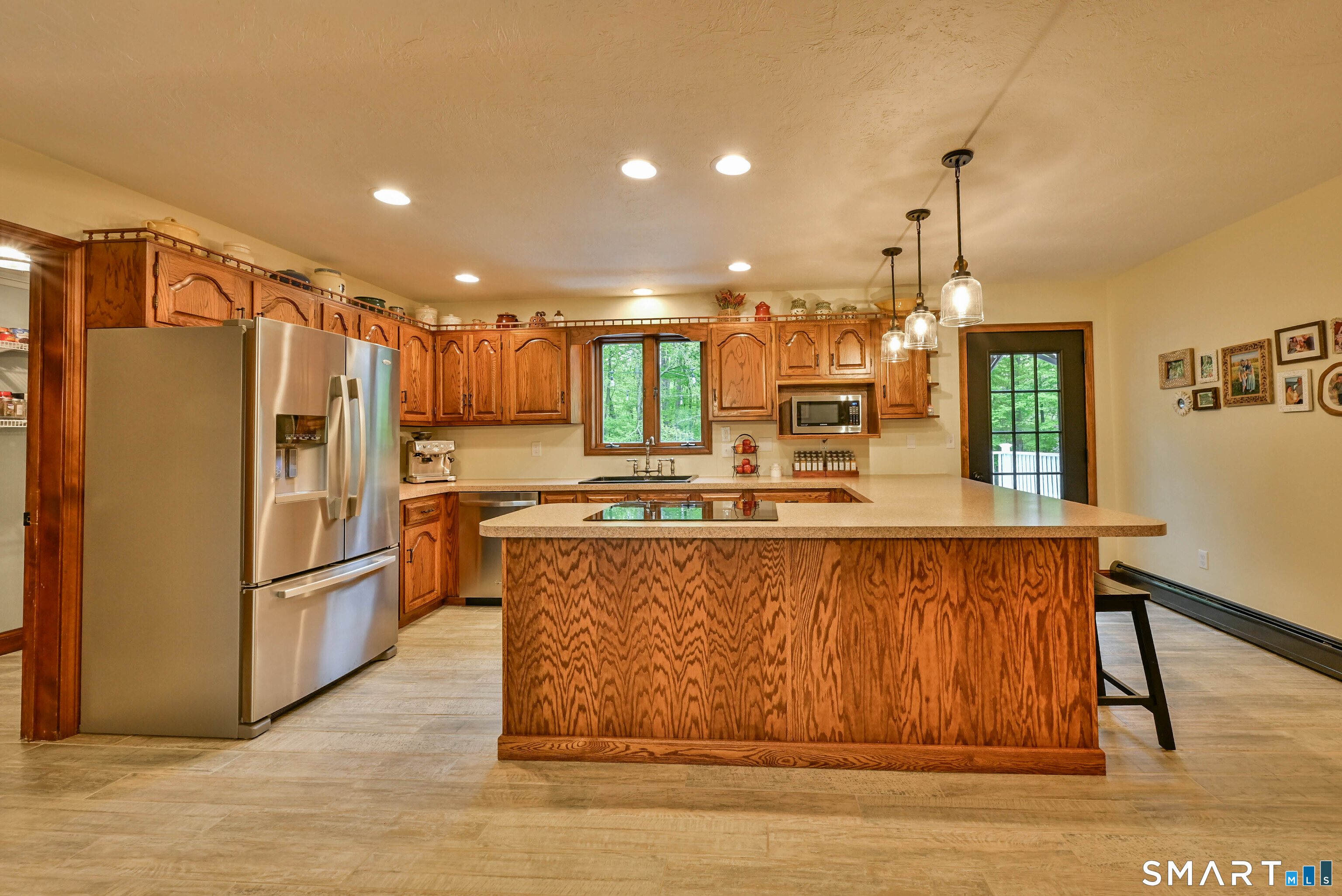 309 O'Leary Road Thompson, CT 06277 - Photo 25 of 40 a large kitchen with stainless steel appliances granite countertop a refrigerator a sink and a stove