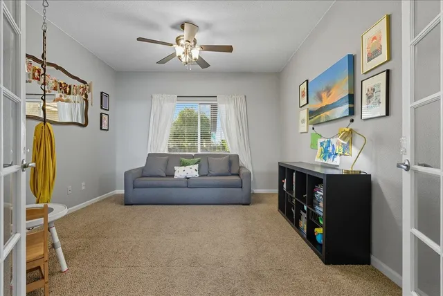 a living room with furniture and a window