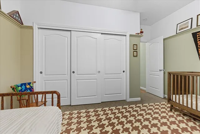 a bedroom with a bed and a table