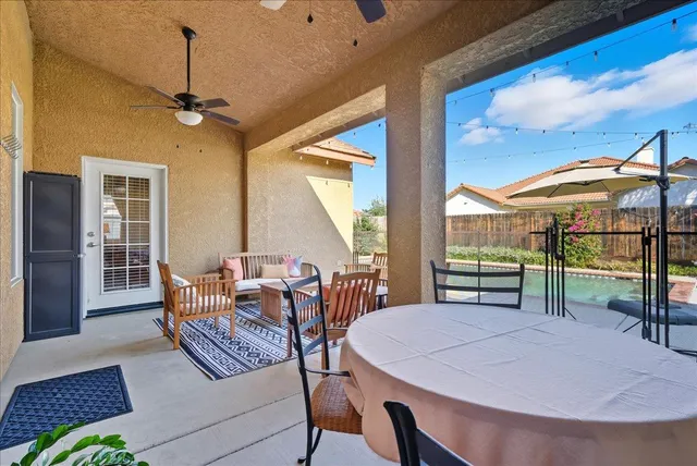 a view of a dining room with furniture window and outside view