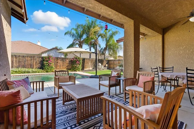 a view of a chairs and table in the patio
