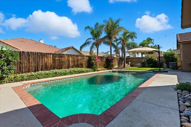 a view of a patio with a swimming pool