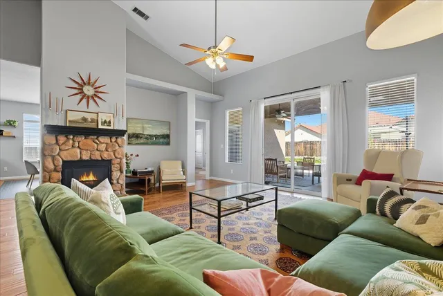 a living room with furniture and a fireplace