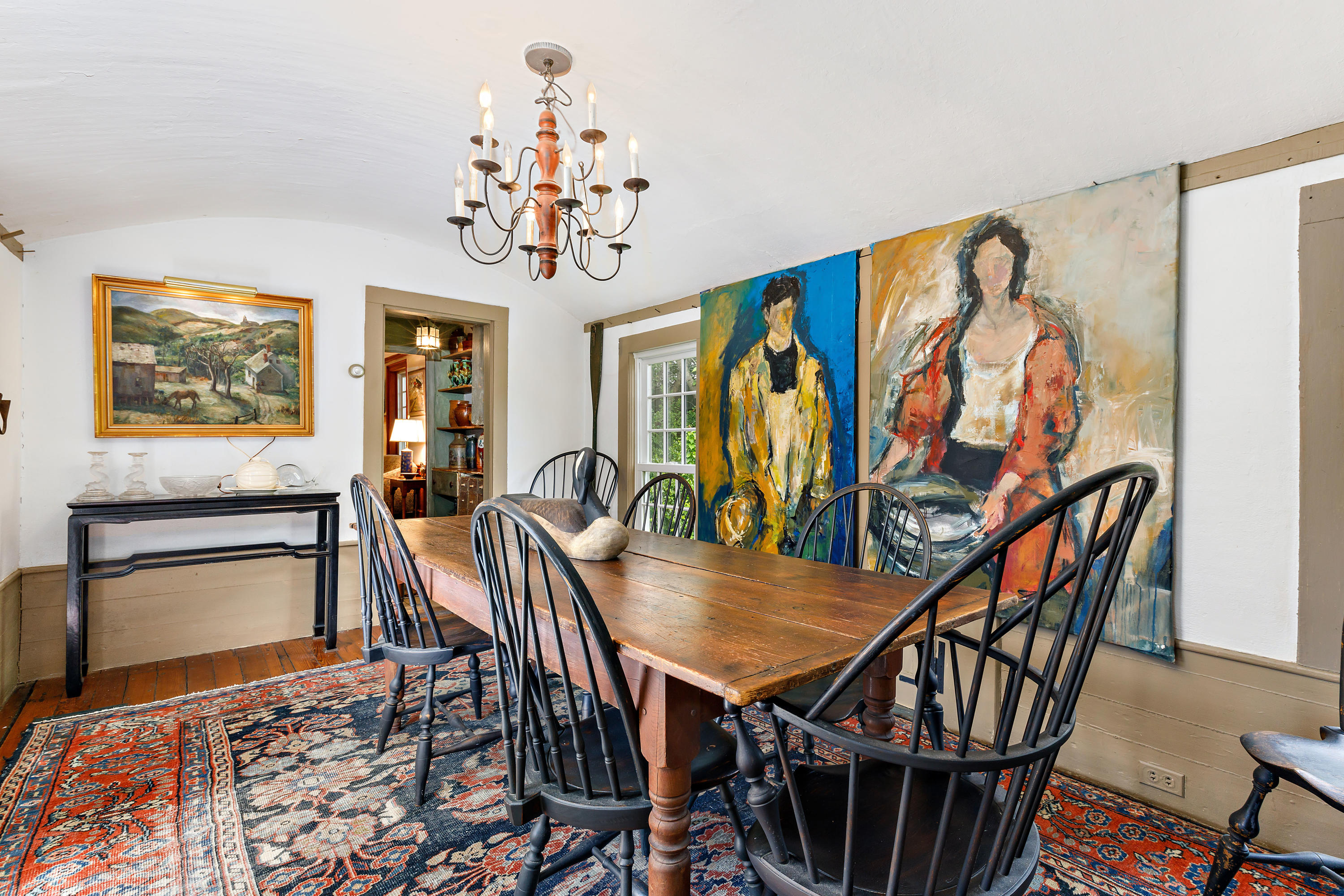 91 Castle Road Truro, MA 02666 - Photo 15 of 78 a view of a dining room with furniture a rug and wooden floor