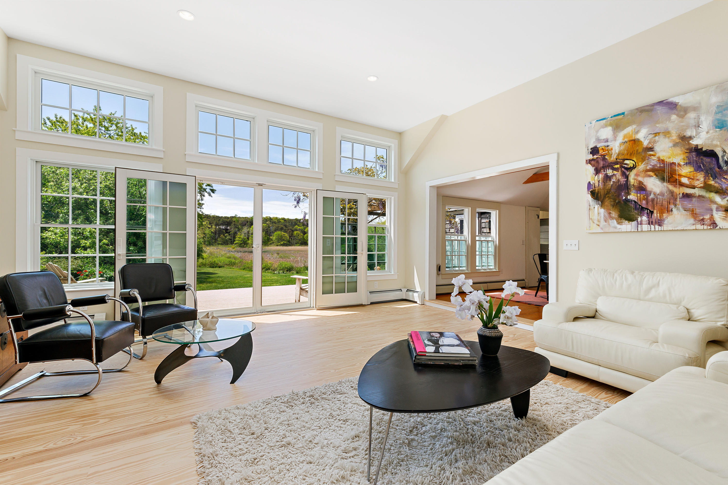 91 Castle Road Truro, MA 02666 - Photo 42 of 78 a living room with furniture and a large window
