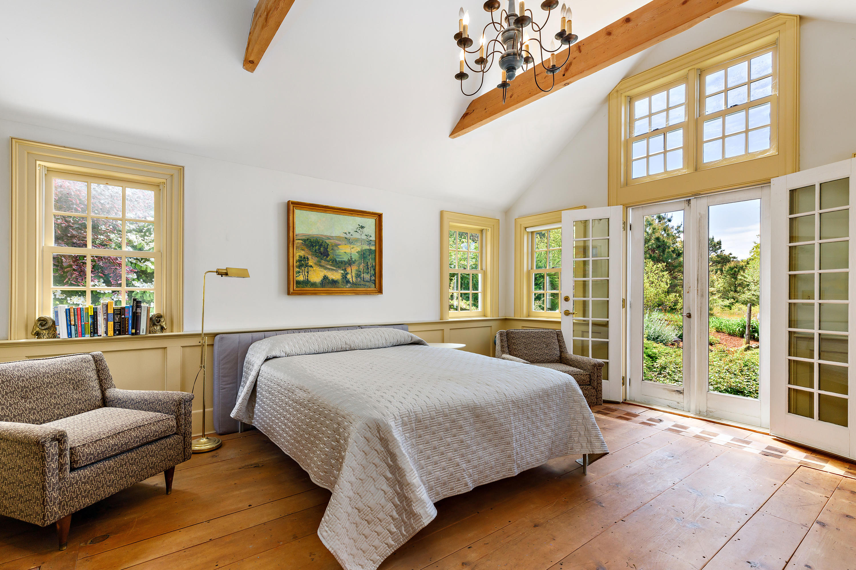 91 Castle Road Truro, MA 02666 - Photo 46 of 78 a bedroom with a large bed and a couch