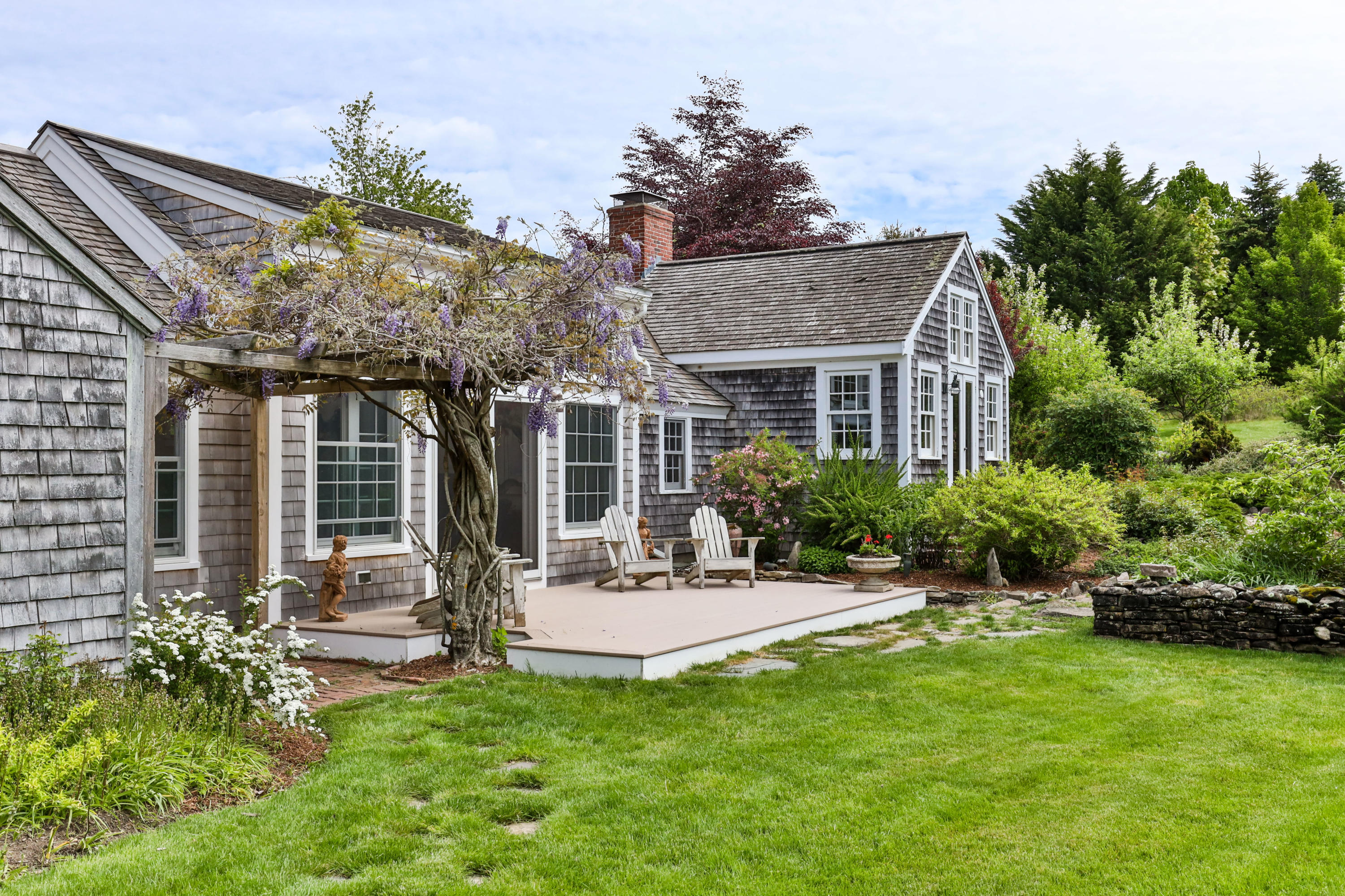 91 Castle Road Truro, MA 02666 - Photo 56 of 78 a view of a house with backyard sitting area and garden