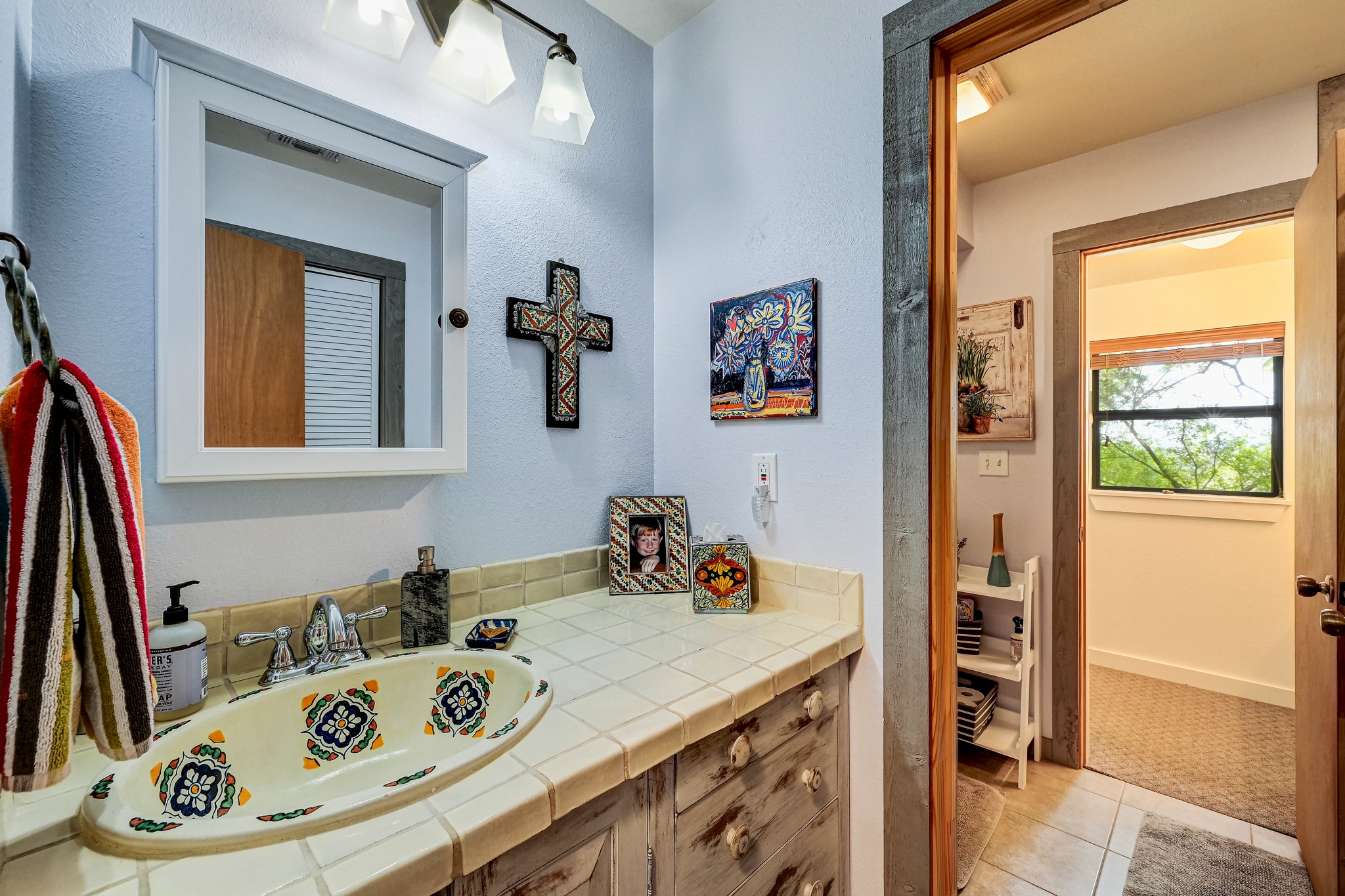 900 Box Canyon Road Wimberley, TX 78676 - Photo 29 of 40 Jack and Jill bathroom between all the secondary bedrooms.