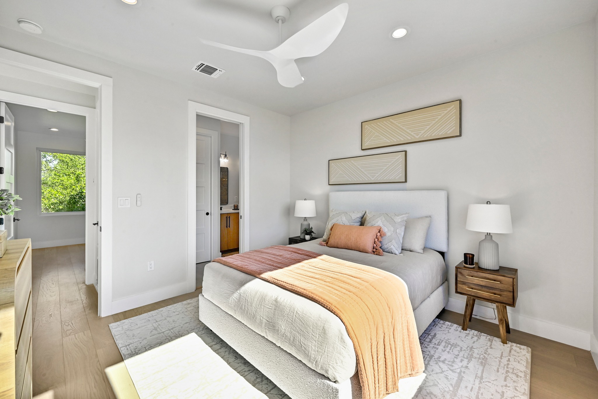 100 West Odell Street, Unit 3 Austin, TX 78752 - Photo 27 of 37 a bedroom with bed and a table