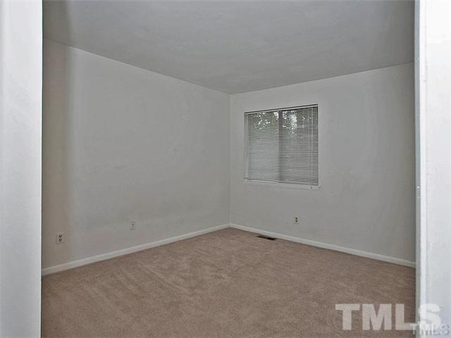 724 Godwin Court Raleigh, NC 27606 - Photo 4 of 8 an empty room with a window