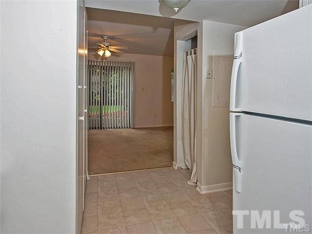 724 Godwin Court Raleigh, NC 27606 - Photo 6 of 8 a view of a bathroom with a shower