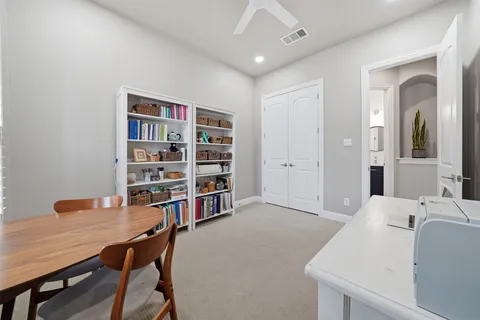 a view of a workspace with furniture