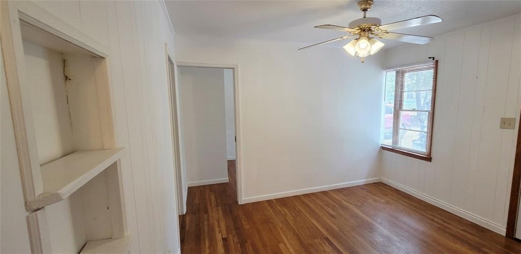 389 Collins Road Toccoa, GA 30577 - Photo 15 of 15 a view of empty room with wooden floor and fan