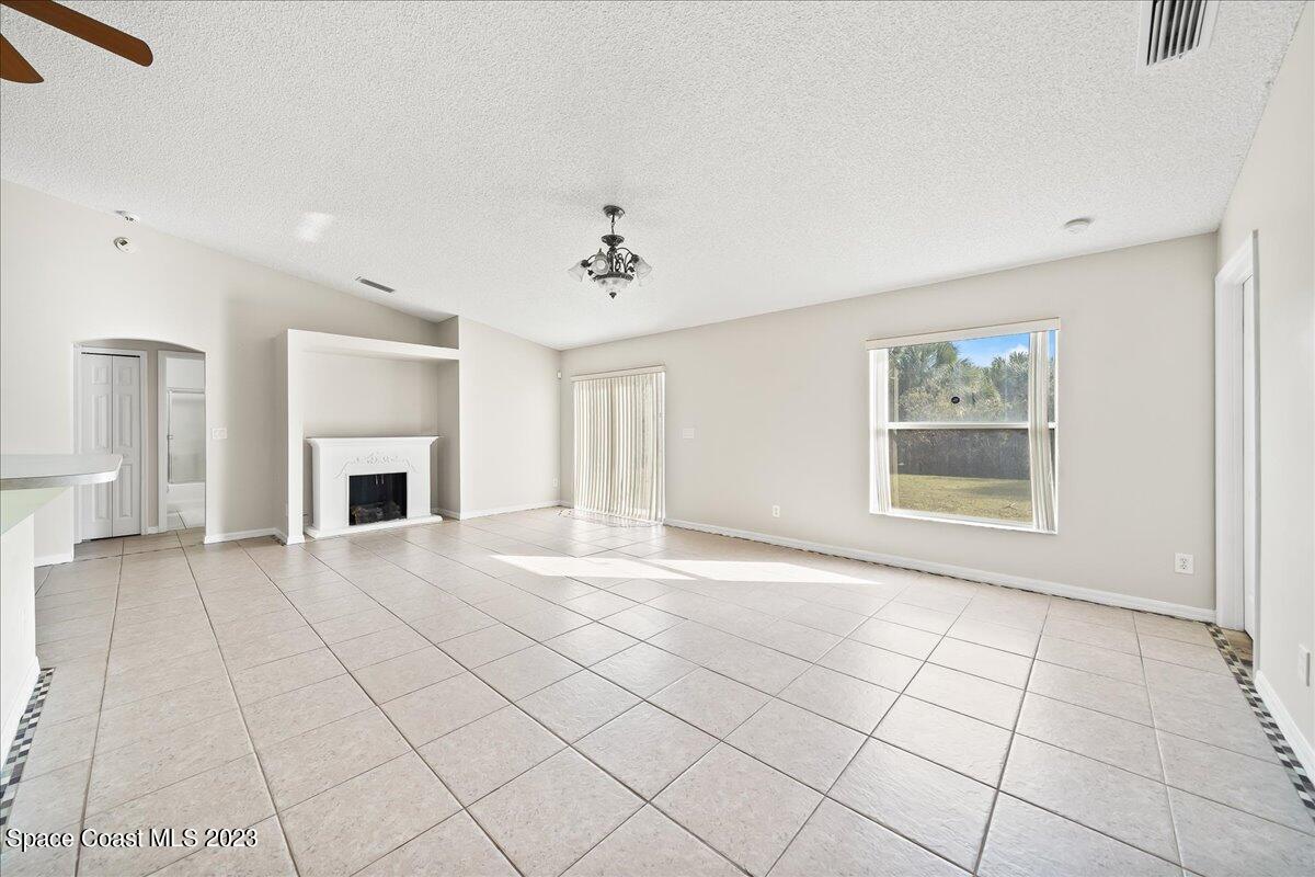 590 Fountain Street Southwest Palm Bay, FL 32908 - Photo 16 of 40 a view of an empty room with a window