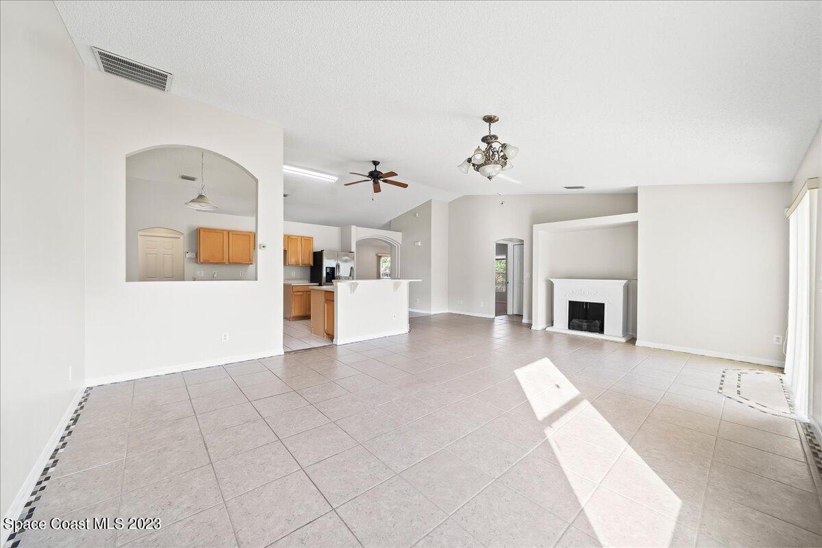 590 Fountain Street Southwest Palm Bay, FL 32908 - Photo 17 of 40 a view of a livingroom with a fireplace