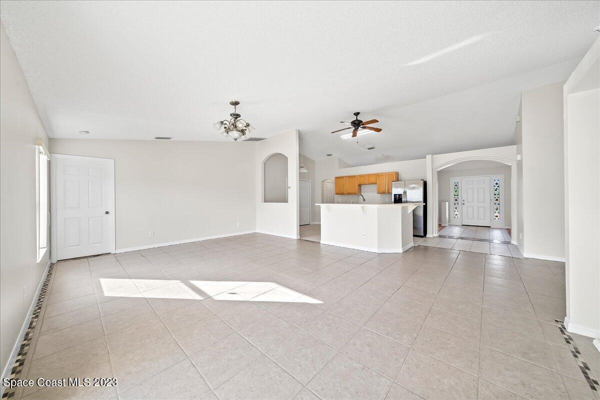 590 Fountain Street Southwest Palm Bay, FL 32908 - Photo 18 of 40 wooden floor in an empty room with a window