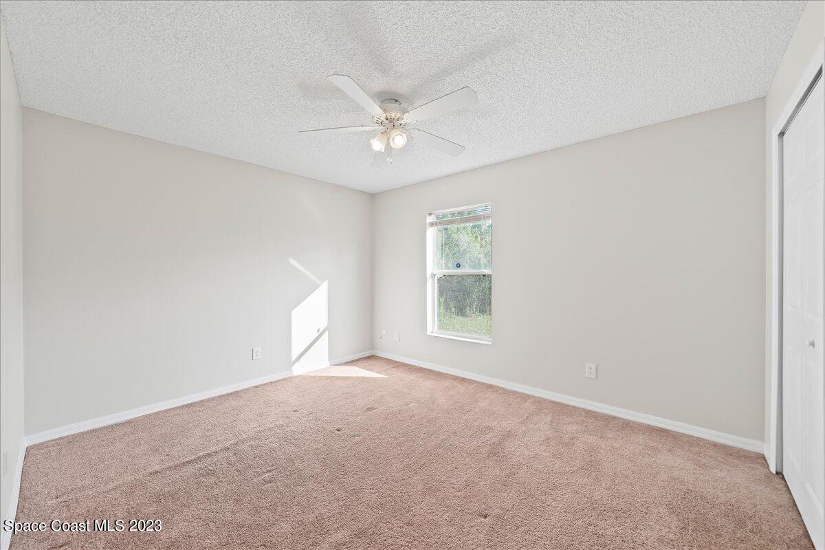 590 Fountain Street Southwest Palm Bay, FL 32908 - Photo 20 of 40 a view of an empty room with a window