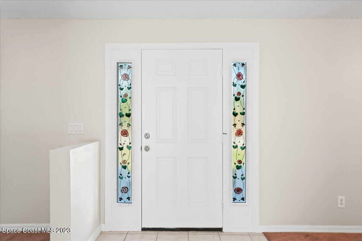 590 Fountain Street Southwest Palm Bay, FL 32908 - Photo 4 of 40 a view of an entryway with wooden floor