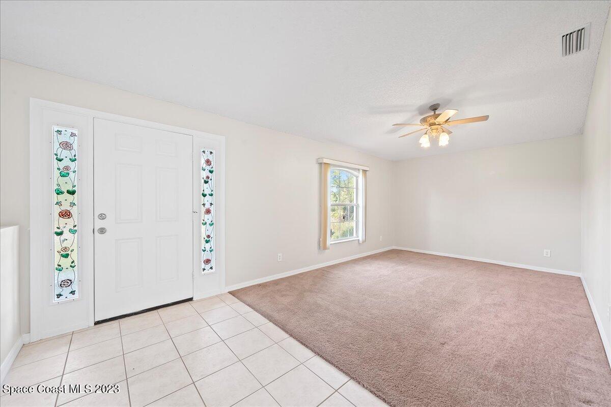 590 Fountain Street Southwest Palm Bay, FL 32908 - Photo 5 of 40 a view of an empty room with a window
