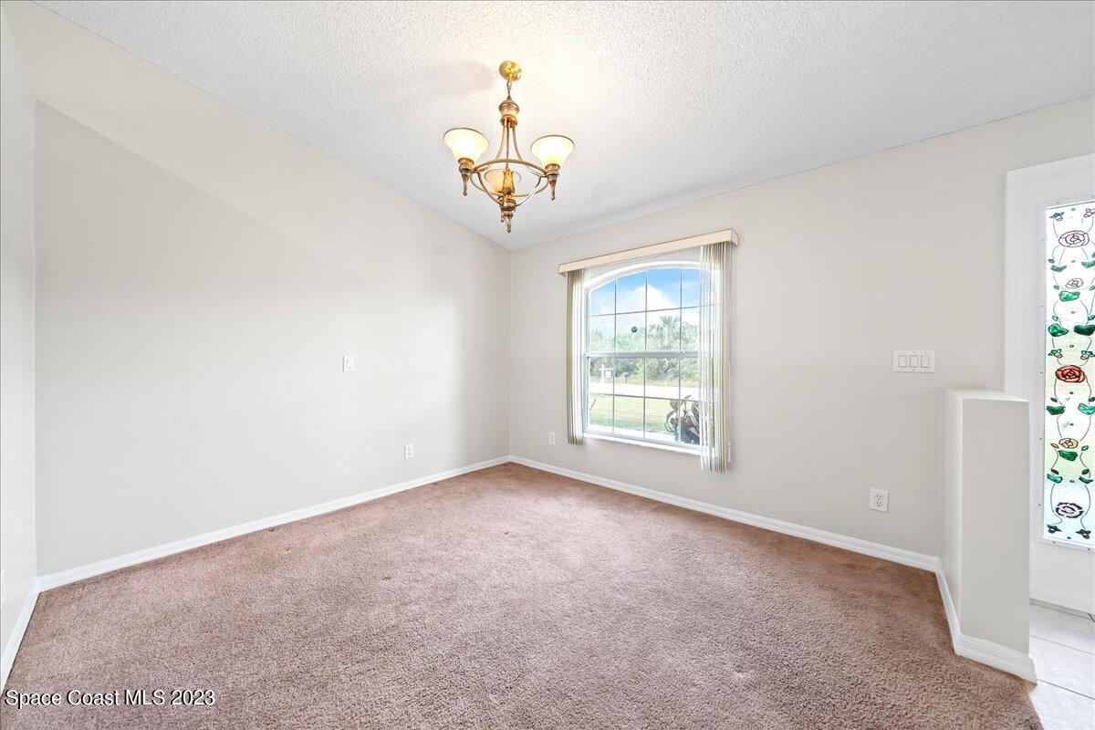 590 Fountain Street Southwest Palm Bay, FL 32908 - Photo 7 of 40 a view of a livingroom with a window