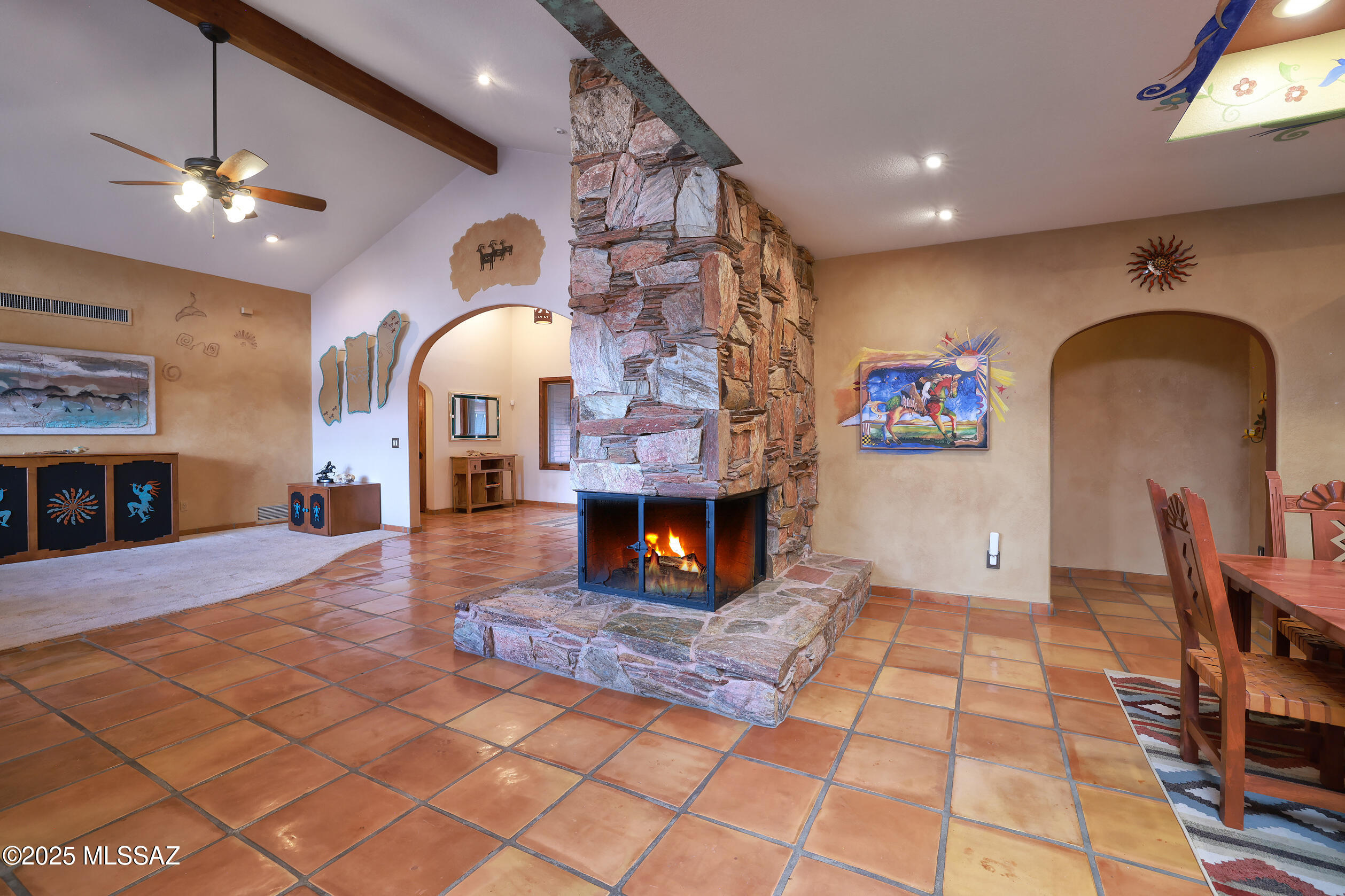 925 North Rancho Del Jefe Loop Tucson, AZ 85748 - Photo 15 of 52 a living room with fireplace furniture and a chandelier