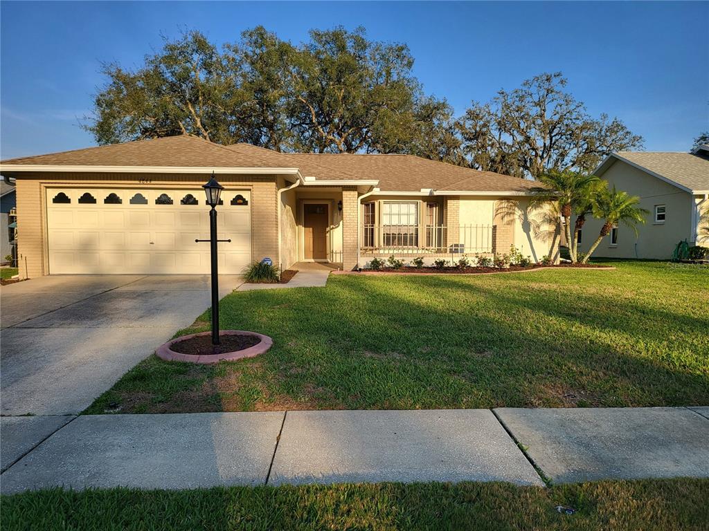 4844 Prince George Circle New Port Richey, FL 34655 - Photo 1 of 1 Beautifully maintained home with decorative landscape borders around flower beds